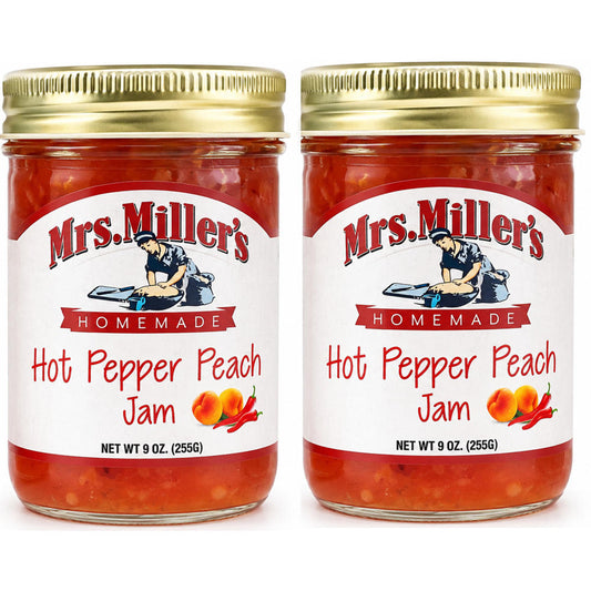 Two clear glass jars of Mrs. Miller's Homemade Hot Pepper Peach Jam side by side on a clean white background.