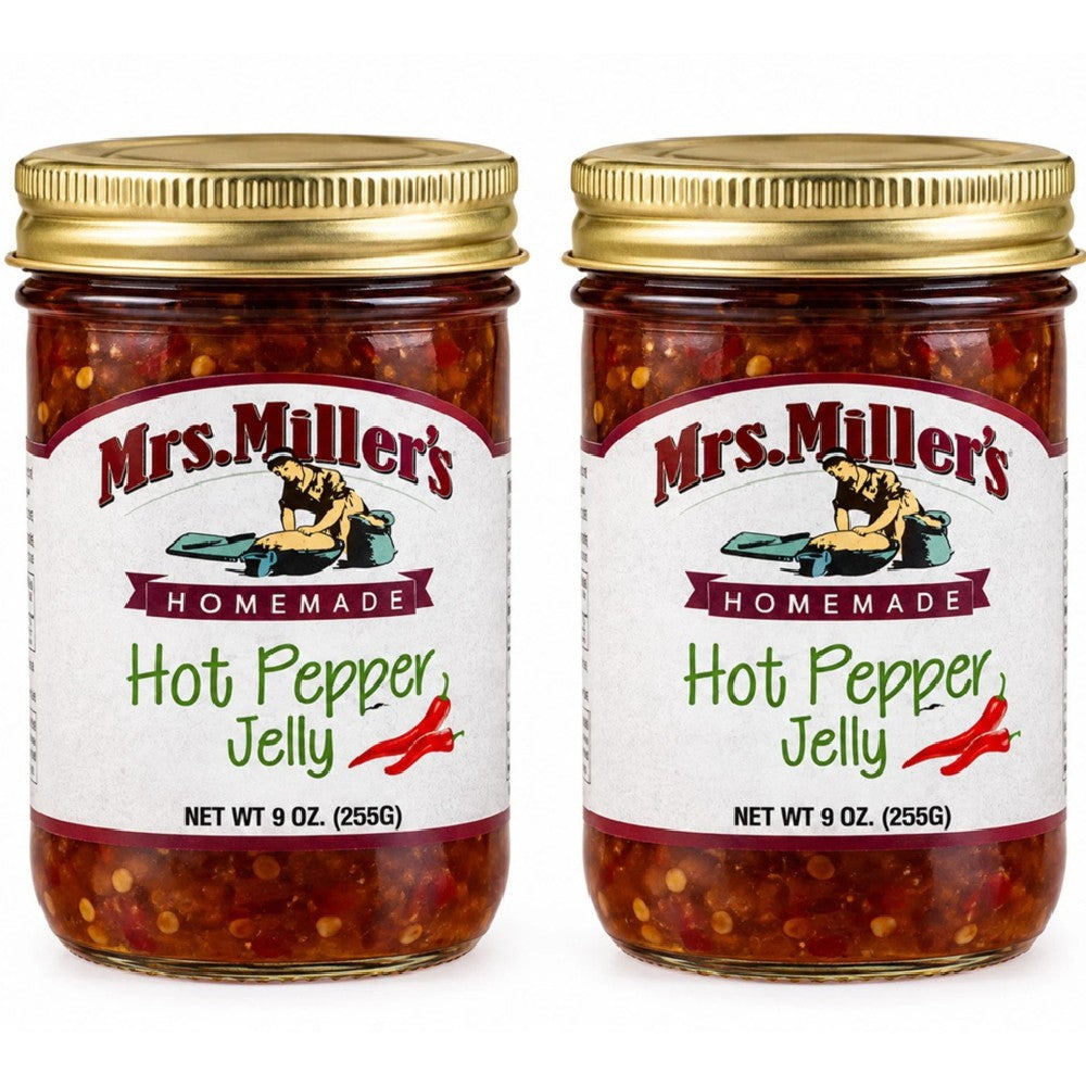 • Two clear glass jars of Mrs. Miller's Homemade Hot Pepper Jelly side by side on a clean white background.