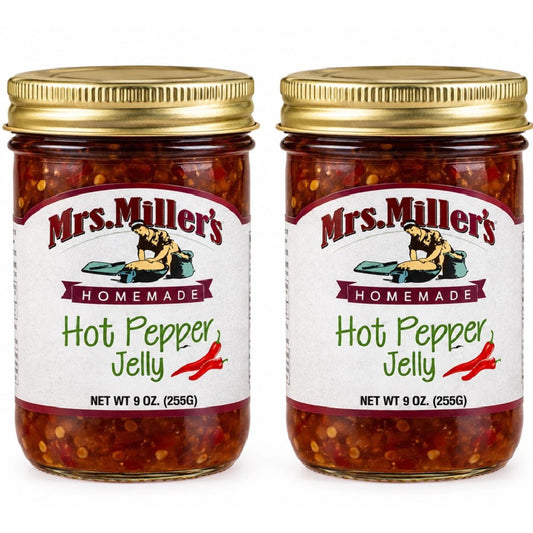 • Two clear glass jars of Mrs. Miller's Homemade Hot Pepper Jelly side by side on a clean white background.