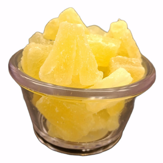 Bowl of sweetened sun-dried pineapple chunks